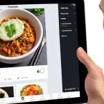** A user experience (UX) designer conducting user research for a food delivery app, showing a user struggling to find vegetarian options. Focus on the designer empathetically observing the user's frustration and a screen displaying the confusing interface.

**
